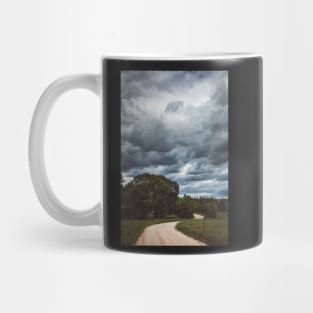 Country road under dark cloudy sky Mug